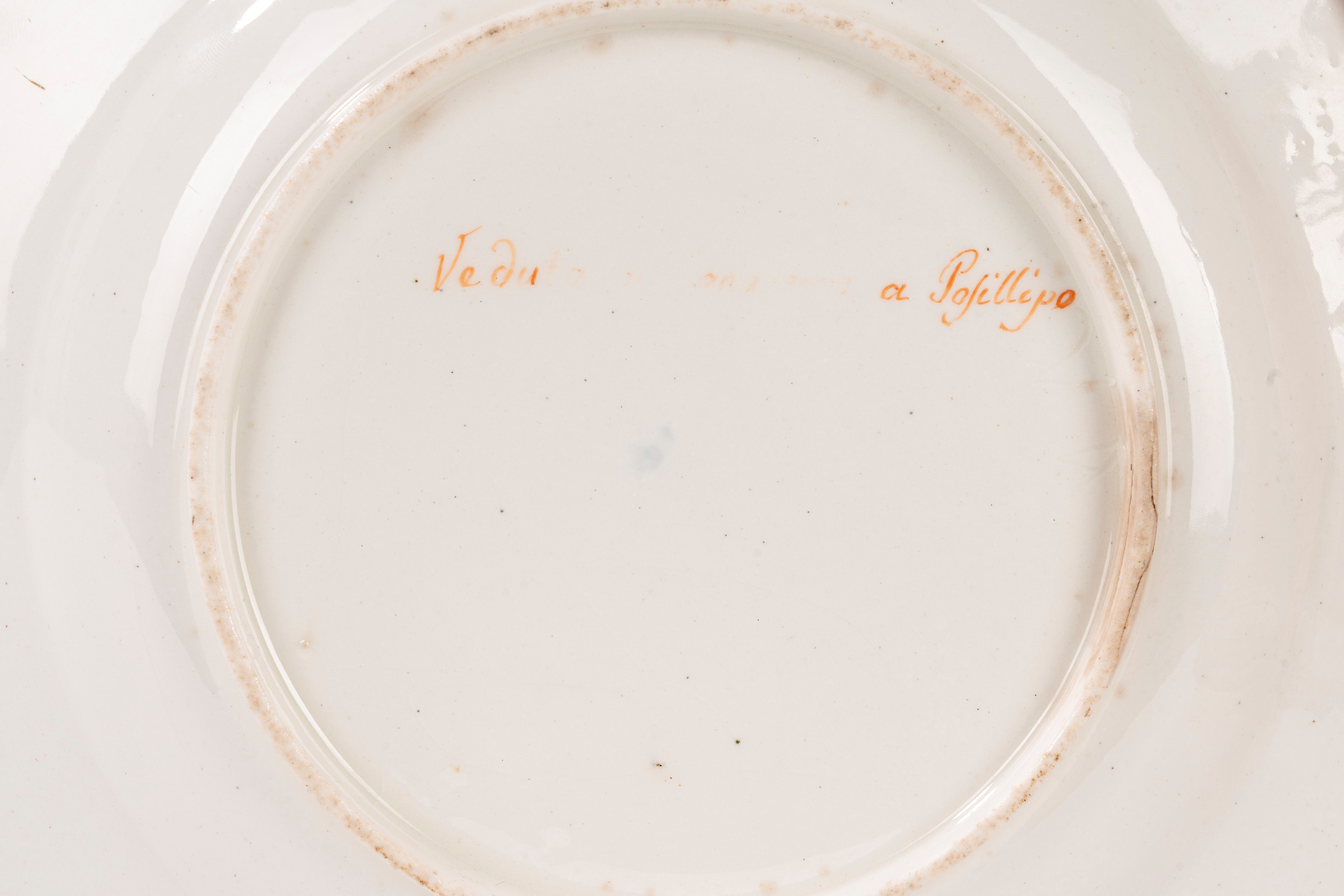 Lotto di 13 piatti in porcellana con vedute di Napoli, Real Fabbrica Ferdinandea, fine XVIII seco...