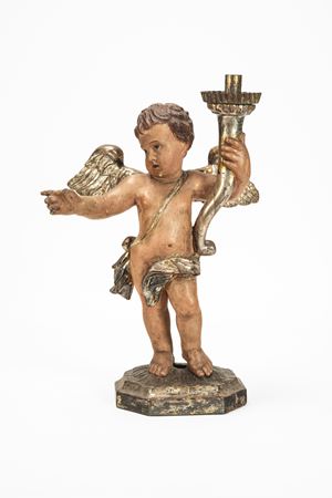 Putto reggi torcia in legno scolpito e dipinto. Secolo XIX