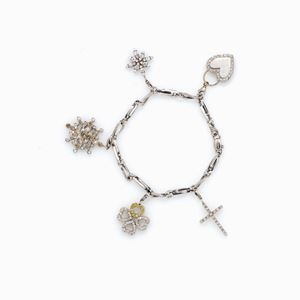 BRACCIALE CON CHARMS IN ORO E DIAMANTI, 