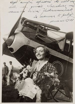 Gabriella Angelini, più nota con il diminutivo Gaby (Susa, 24 settembre 1911 – Uadi el-Ghelta, 3 dicembre 1932), è stata un'aviatrice italiana. Sognando di eguagliare le gesta compiute dai piloti nei pericolosi raid aerei dell'epoca, Gaby decise di effettuare un raid europeo in 25 giorni, facendo tappa in varie città europee sorvolando Austria, Cecoslovacchia, Germania, Danimarca, Svezia, Paesi Bassi, Regno Unito e Francia.
L'impresa le procurò un'improvvisa popolarità internazionale: al suo ritorno a Milano, fu accolta da una folla di curiosi e giornalisti che, alla stregua della stampa estera, l'avevano ribattezzata Little Gaby. La facilità con la quale aveva portato a termine il raid la spinse a tentare subito un'ardua impresa: il viaggio da Milano a Delhi, facendo scalo a Roma, Trapani, Tunisi, Tripoli, Tobruk, Il Cairo, Gerusalemme, Bagdad, Bassora e Karachi, promosso dall'Aereo Club Milano e fortemente pubblicizzato dal regime. Ma il 3 dicembre del 1932, durante la tappa Bengasi-Tobruk, decise di attraversare il deserto libico, ritenendolo meno pericoloso ma, a causa di una tempesta di sabbia, il suo aereo ebbe un'avaria e precipitò nei pressi dell'oasi di Uadi el-Ghelta. La salma di Gaby Angelini, ritrovata dopo giorni di ricerca, fu riportata in Italia ed esposta all'omaggio pubblico a Milano nella Casa del Fascio, quindi tumulata nel Cimitero monumentale. Foto con dedica