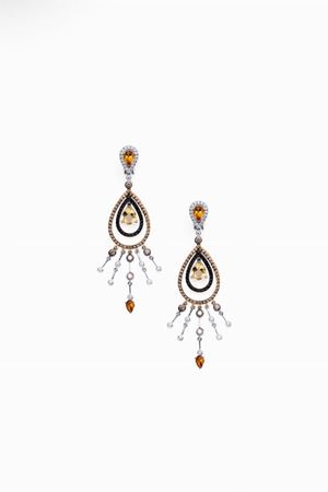 in oro bicolore 18kt, quarzi e diamanti