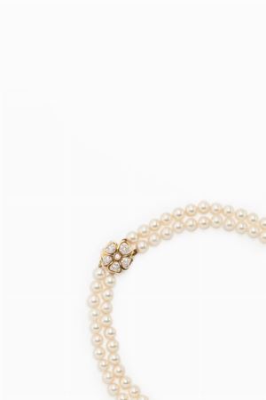 in oro bicolore 18kt, perle coltivate e diamanti