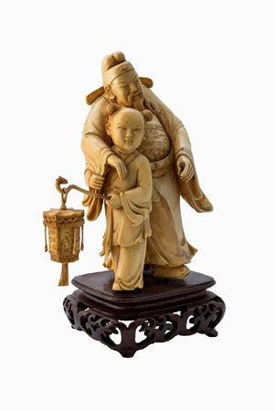 Ivory sculpture representing an old blind man with a child, China 20th century
