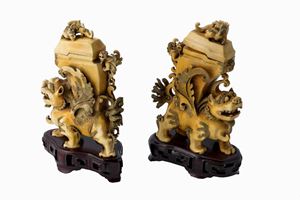 Two Fo dogs, China 20th century, with wooden bases