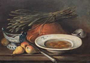 Still life with asparagus, pears and eggs in a  on a table