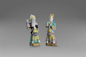 Two polychrome porcelain figurines depicting dignitaries, 18th century China