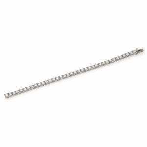 BRACCIALE TENNIS IN ORO E DIAMANTI, CIRCA 2000