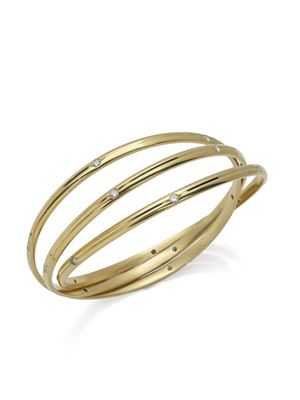 YELLOW GOLD 18K BANGLE WITH BRILLIANT CUT DIAMONDS, TRINITY DE CARTIER, CIRCA 1992