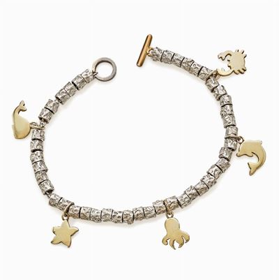 Bracciale in argento con charms in oro giallo a soggetti marini