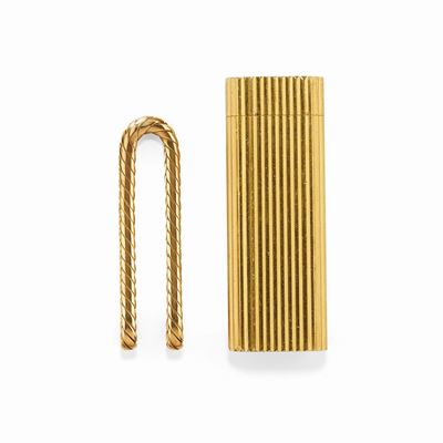Accendino Cartier in oro giallo 18K e fermasoldi placcato oro giallo
