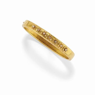 Bracciale rigido in oro giallo 18K con decorazioni floreali