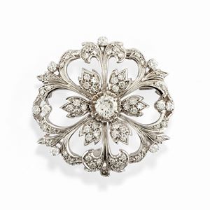 A 18K white gold and diamond brooch, defects