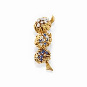 A 18K yellow gold, sapphire and diamond brooch