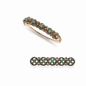 A 18k yellow gold, silver, emerald and diamond demi parure