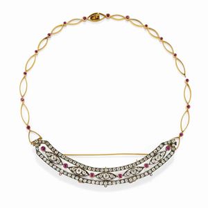A silver, 18K yellow gold, diamond and ruby brooch-necklace, early 20th Century, defects