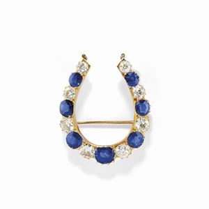 A 18K yellow gold, diamond and sapphire brooch, early 20th Century