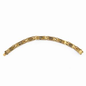A 18K yellow gold and enamel bracelet, early 20th Century, defects