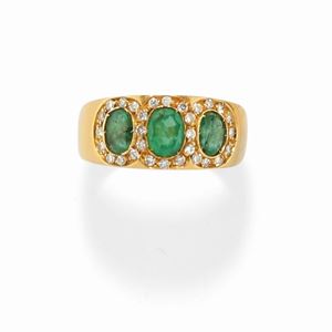 A 18K yellow gold, emerald and diamond ring