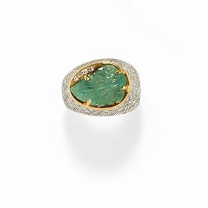 A 18K two-color gold, emerald and diamond ring