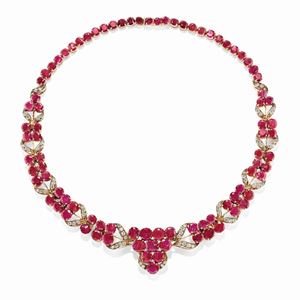 A silver, 18K yellow gold, diamond and ruby necklace