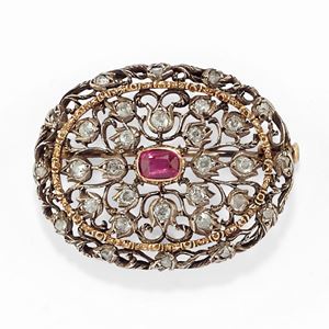 A silver, 18K yellow gold, ruby and diamond brooch, Mario Buccellati