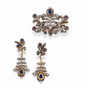 A silver, 18K yellow gold, sapphire and diamond demi parure