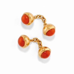 A 18K yellow gold and coral cufflinks, Cartier