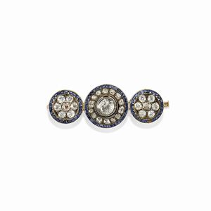 A silver, 18K yellow gold, sapphire and diamond brooch, early 20th Century, defects