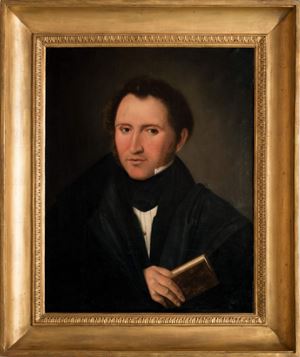 Half-length portrait of a gentleman with book in hand