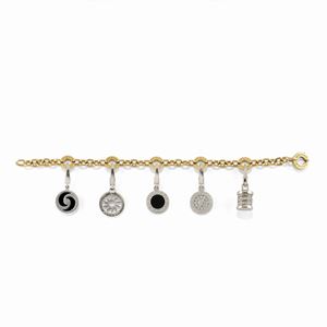 A two color gold, diamond and onyx bracelet with charms, Bulgari