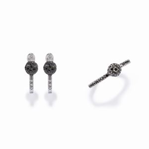 A 18K white gold and diamond earrings and ring.