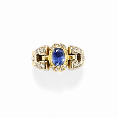 Anello con zaffiro ovale e diamanti in oro giallo 18K