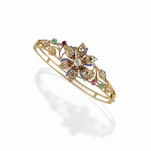 A 18K yellow gold, diamond, ruby, emerald, pearl and enamel bangle, 19th Century, defects