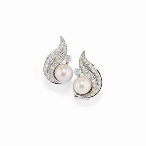 A 18K white gold, cultured pearl and diamond earclips