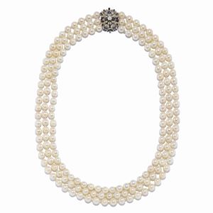 A 18K white gold, cultured pearl, diamond and sapphire necklace