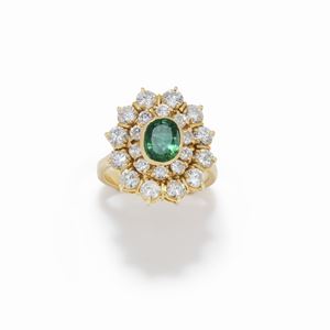 A 18K yellow gold, emerald and diamond ring