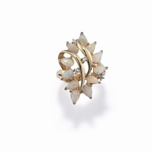 A 14K yellow gold, opal and diamond ring