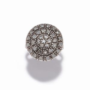 A silver, low-carat gold and diamond ring