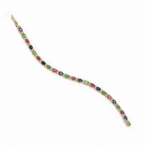 A 18K yellow gold, diamond, ruby, sapphire and emerald bracelet