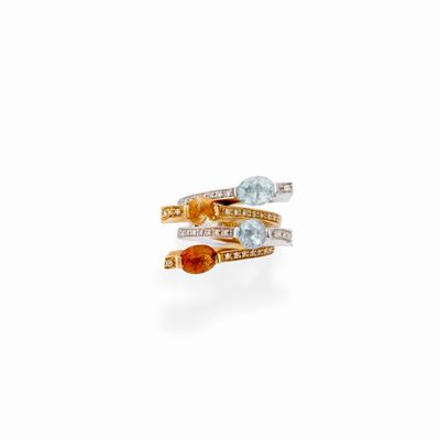 Anello in oro bicolore 18K con quarzo citrino e topazi azzurri