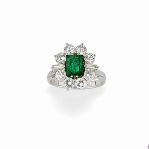 A 18K white gold, emerald and diamond ring