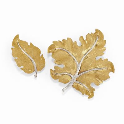 Due spille in oro bicolore 18K con motivo a foglia