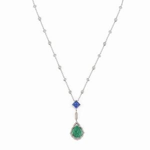 A 18K white gold, emerald, tanzanite and diamonds necklace.