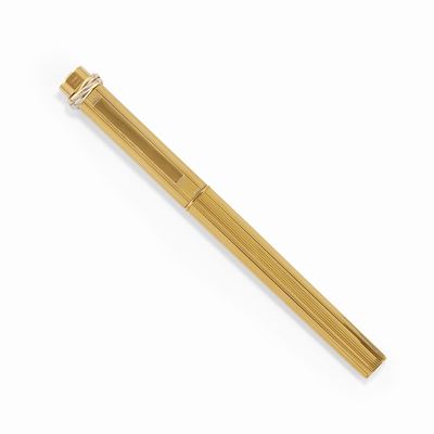 Penna a sfera 'Trinity', placcata in oro giallo con astuccio Cartier