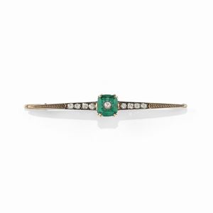 A silver, 18K yellow gold, emerald and diamond brooch, end of 19th Century