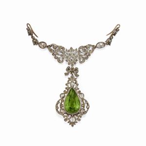 A yellow gold, silver, peridot and diamond pendant, early 20th Century