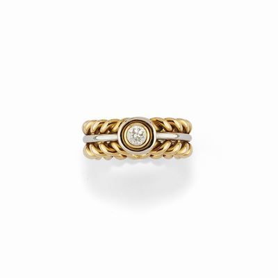 Anello in oro bicolore 18K con diamante taglio brillante di circa 0,20 ct