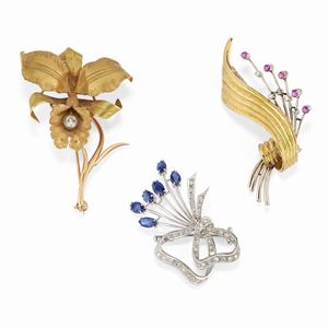 Three 18K yellow and white gold, diamonds, rubies and sapphires brooches