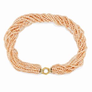 A 18k yellow gold, pink coral and diamond necklace.