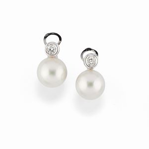 A 18K white gold, pearl and diamond earrings
